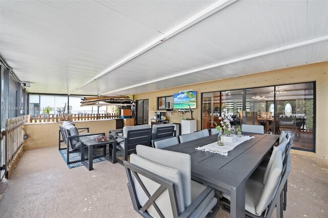 14040 SW 14th St, Davie, FL 33325 - dining area featuring concrete flooring