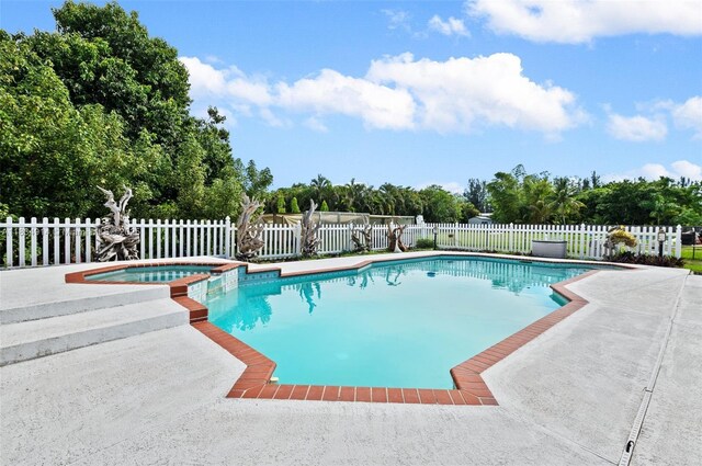 14040 SW 14th St, Davie, FL 33325 - view of pool with a fenced backyard, a patio area, and a pool with connected hot tub