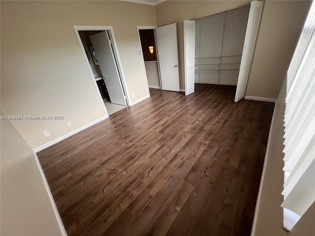 3016 NE 21st Ter Unit 3016, Fort Lauderdale, FL 33306 - unfurnished bedroom featuring dark wood-style floors and baseboards