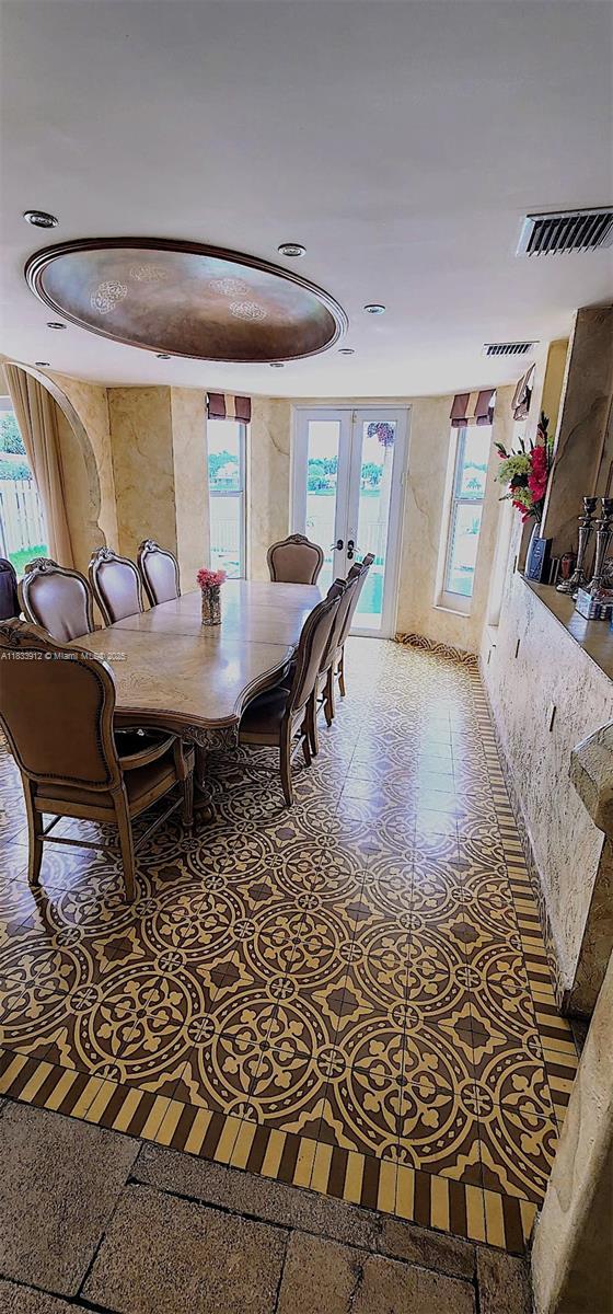 3460 SW 52nd St, Hollywood, FL 33312 - dining area featuring french doors and light flooring