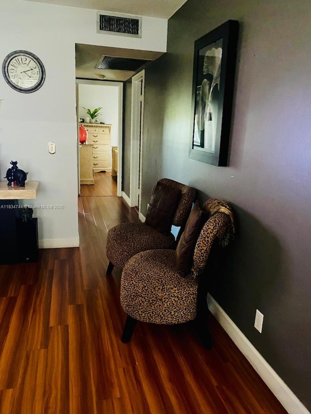 13255 SW 7th Ct Unit 213D, Pembroke Pines, FL 33027 - sitting room featuring baseboards and wood finished floors