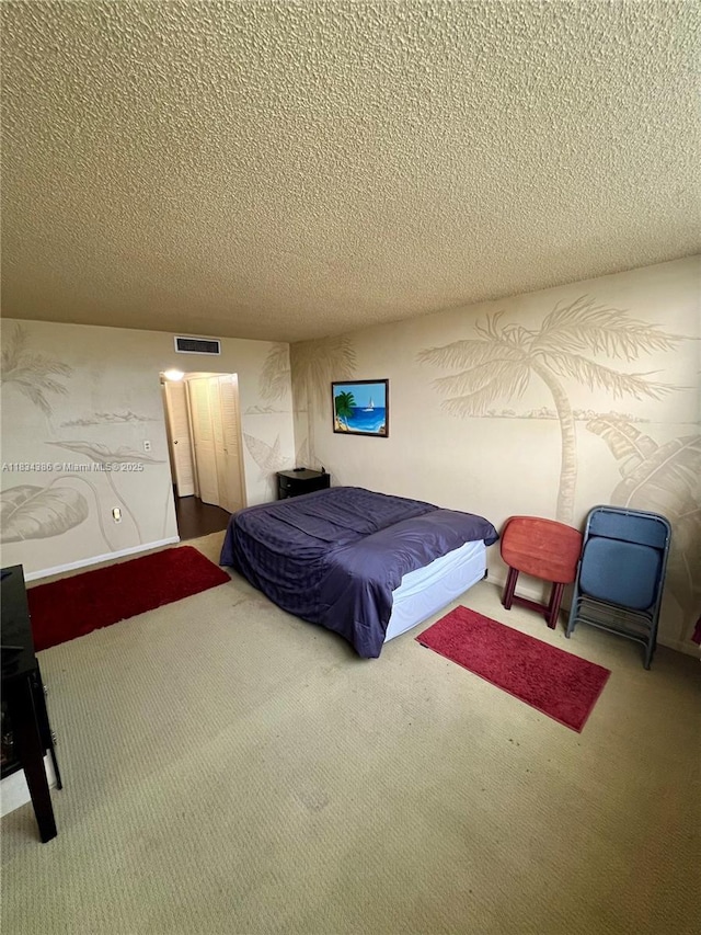 1470 NE 125th Ter Unit 814, North Miami, FL 33161 - carpeted bedroom with a textured ceiling