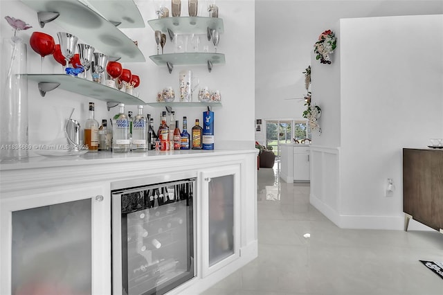 1211 E Wilshire Cir, Pembroke Pines, FL 33027 - indoor dry bar featuring beverage cooler and light tile patterned flooring