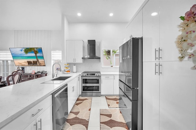 1211 E Wilshire Cir, Pembroke Pines, FL 33027 - kitchen featuring appliances with stainless steel finishes, wall chimney exhaust hood, light stone countertops, white cabinets, and recessed lighting