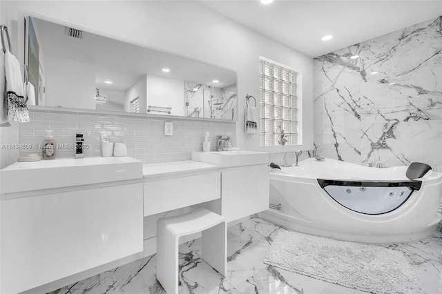 1211 E Wilshire Cir, Pembroke Pines, FL 33027 - bathroom with double vanity, a tub with jets, recessed lighting, tasteful backsplash, and marble tiled floors