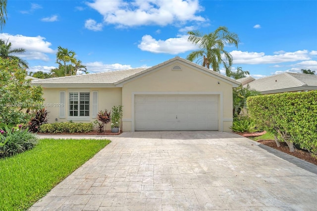 1211 E Wilshire Cir, Pembroke Pines, FL 33027 - ranch-style house with stucco siding, decorative driveway, a tiled roof, a garage, and a front yard