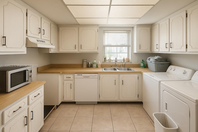 7523 W Sunrise Blvd Unit B2, Plantation, FL 33313 - laundry area featuring separate washer and dryer and light tile patterned flooring