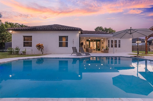 14501 SW 33rd Ct, Miramar, FL 33027 - pool at dusk featuring a patio area