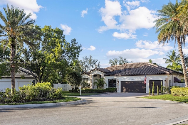 14501 SW 33rd Ct, Miramar, FL 33027 - mediterranean / spanish-style home with stucco siding, driveway, an attached garage, and a tiled roof
