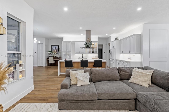 14501 SW 33rd Ct, Miramar, FL 33027 - living room featuring light wood-style flooring, recessed lighting, and a chandelier