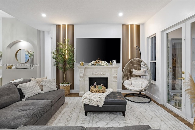 14501 SW 33rd Ct, Miramar, FL 33027 - living room with wood finished floors, recessed lighting, and a high end fireplace
