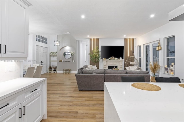 14501 SW 33rd Ct, Miramar, FL 33027 - living area with light wood finished floors, recessed lighting, and a fireplace