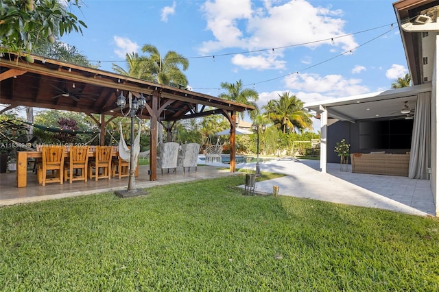 14501 SW 33rd Ct, Miramar, FL 33027 - view of grassy yard featuring ceiling fan and a patio