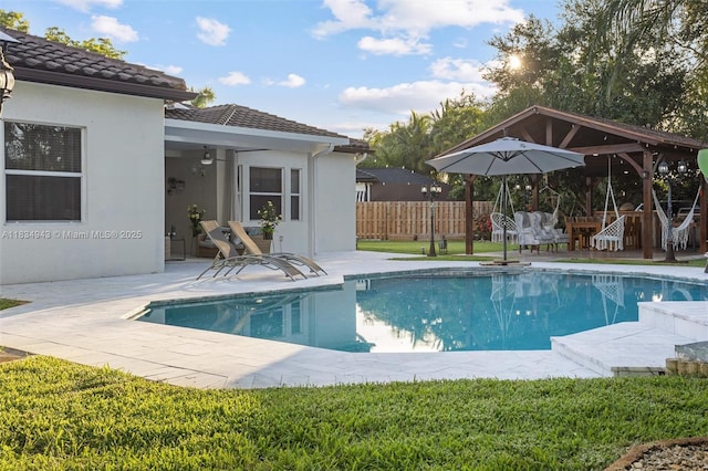 14501 SW 33rd Ct, Miramar, FL 33027 - view of swimming pool featuring ceiling fan and a patio