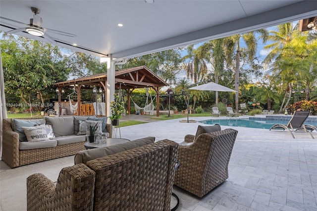 14501 SW 33rd Ct, Miramar, FL 33027 - view of patio / terrace with outdoor lounge area, a gazebo, an outdoor pool, and ceiling fan