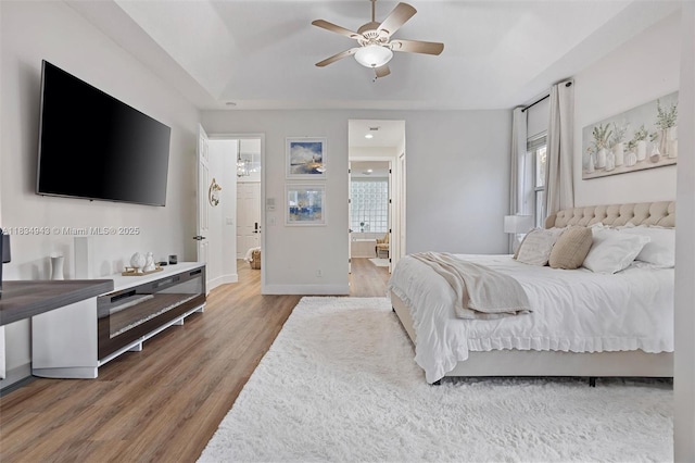 14501 SW 33rd Ct, Miramar, FL 33027 - bedroom featuring wood finished floors, ensuite bathroom, and ceiling fan