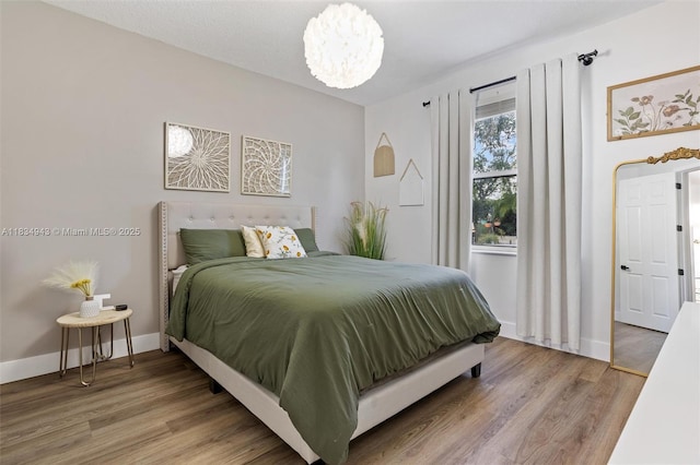 14501 SW 33rd Ct, Miramar, FL 33027 - bedroom featuring light wood-style floors and a chandelier