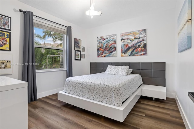 14501 SW 33rd Ct, Miramar, FL 33027 - bedroom with dark wood-type flooring and baseboards
