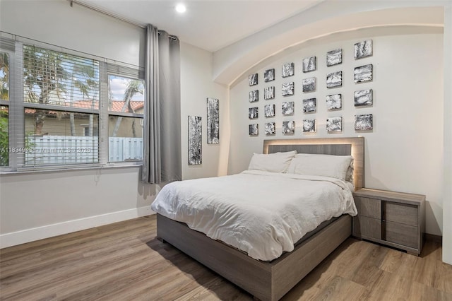 14501 SW 33rd Ct, Miramar, FL 33027 - bedroom with wood finished floors, recessed lighting, and arched walkways