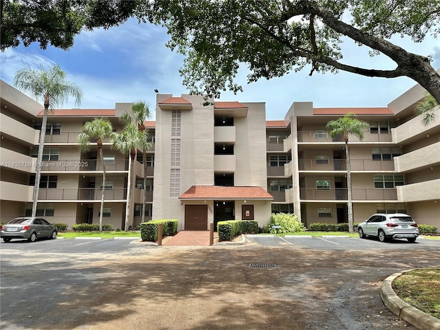 1831 Sabal Palm Dr Unit 404, Davie, FL 33324 - view of apartment building / complex featuring uncovered parking