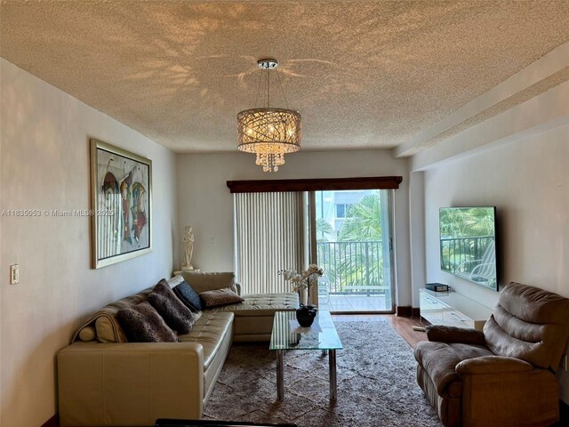 201 180th Dr Unit 114, Sunny Isles Beach, FL 33160 - dining area with a textured ceiling and light tile patterned floors