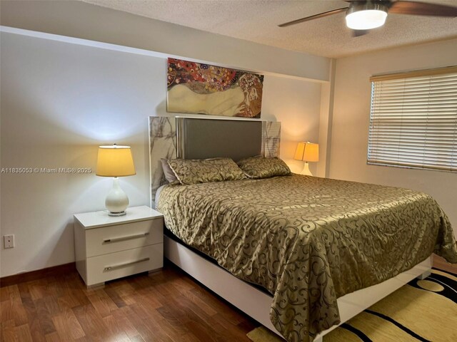201 180th Dr Unit 114, Sunny Isles Beach, FL 33160 - bedroom with wood finished floors, a textured ceiling, and ceiling fan