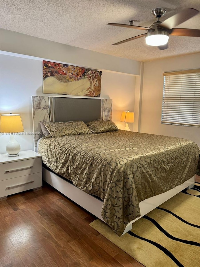 201 180th Dr Unit 114, Sunny Isles Beach, FL 33160 - bedroom with wood finished floors, a textured ceiling, and ceiling fan