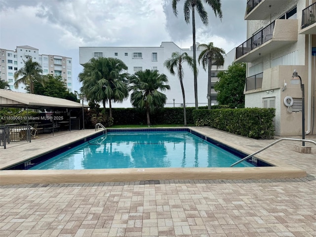 201 180th Dr Unit 114, Sunny Isles Beach, FL 33160 - community pool featuring a patio area