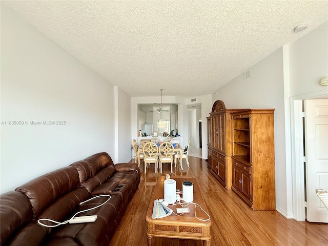 9575 Weldon Cir Unit C406, Tamarac, FL 33321 - living area with wood finished floors and a textured ceiling