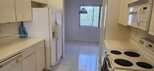 9575 Weldon Cir Unit C406, Tamarac, FL 33321 - kitchen with white appliances, white cabinets, light countertops, light tile patterned flooring, and pendant lighting