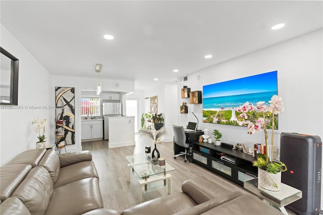 2418 NW 52nd St, Tamarac, FL 33309 - living room featuring light wood finished floors and recessed lighting