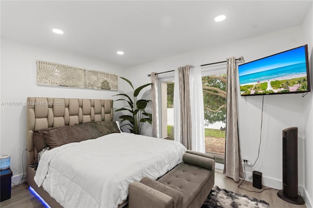 2418 NW 52nd St, Tamarac, FL 33309 - bedroom with wood finished floors, recessed lighting, and access to exterior