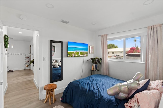 2418 NW 52nd St, Tamarac, FL 33309 - bedroom with light wood finished floors