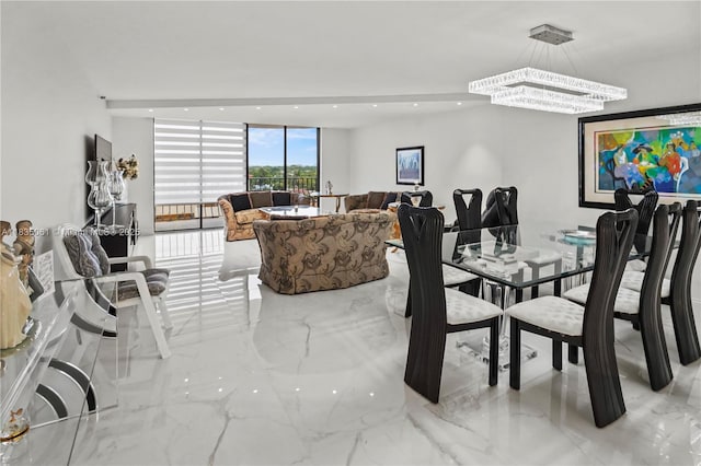 8877 Collins Ave Unit 705, Surfside, FL 33154 - dining room featuring marble tiled floors, a chandelier, and recessed lighting