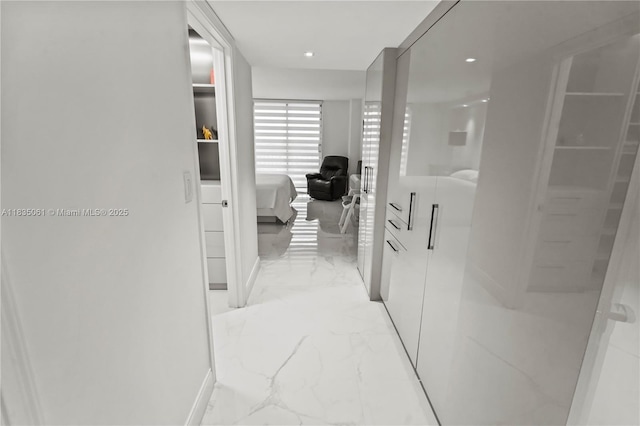 8877 Collins Ave Unit 705, Surfside, FL 33154 - hall featuring light marble finish floors and recessed lighting