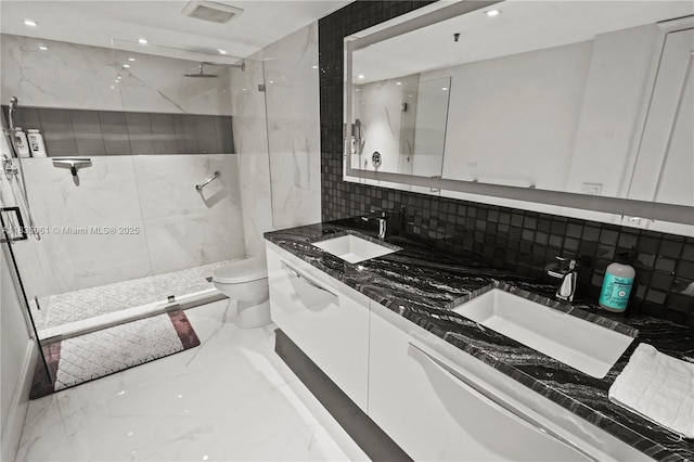 8877 Collins Ave Unit 705, Surfside, FL 33154 - bathroom featuring marble tiled flooring, a marble finish shower, double vanity, recessed lighting, and decorative backsplash