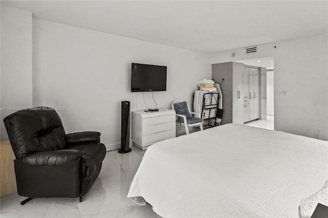 8877 Collins Ave Unit 705, Surfside, FL 33154 - bedroom featuring light marble finish floors