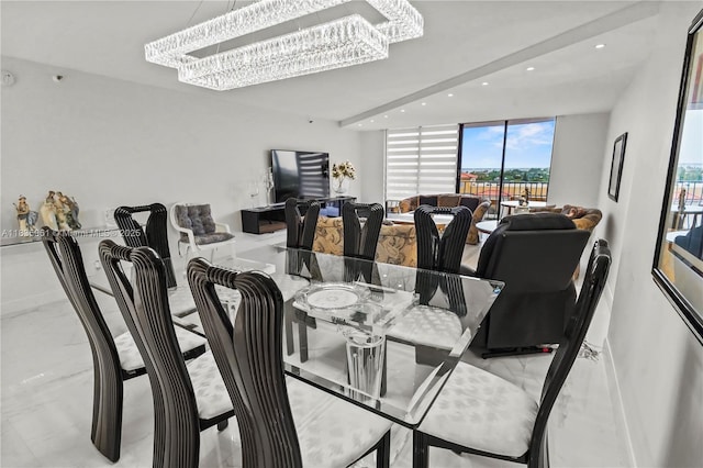 8877 Collins Ave Unit 705, Surfside, FL 33154 - dining room featuring recessed lighting, a chandelier, and marble tiled flooring
