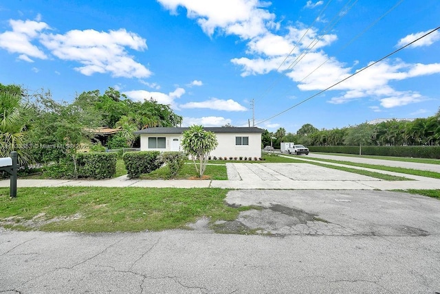5201 Wiley St, Hollywood, FL 33021 - view of front of home with driveway and a front lawn