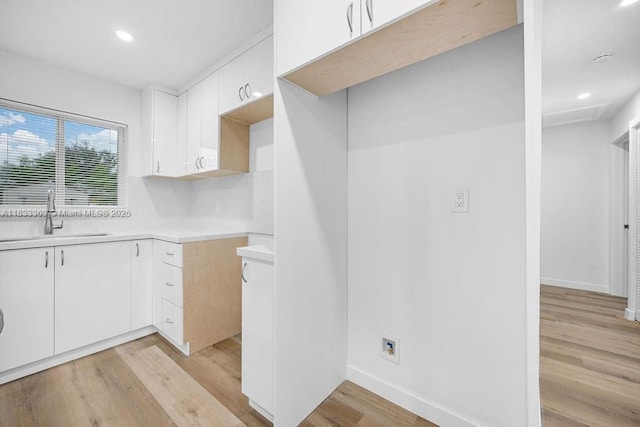 5201 Wiley St, Hollywood, FL 33021 - kitchen featuring light wood-type flooring, light countertops, white cabinets, and recessed lighting