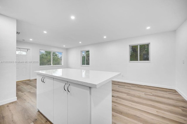 5201 Wiley St, Hollywood, FL 33021 - kitchen featuring a kitchen island, white cabinets, light wood finished floors, and recessed lighting