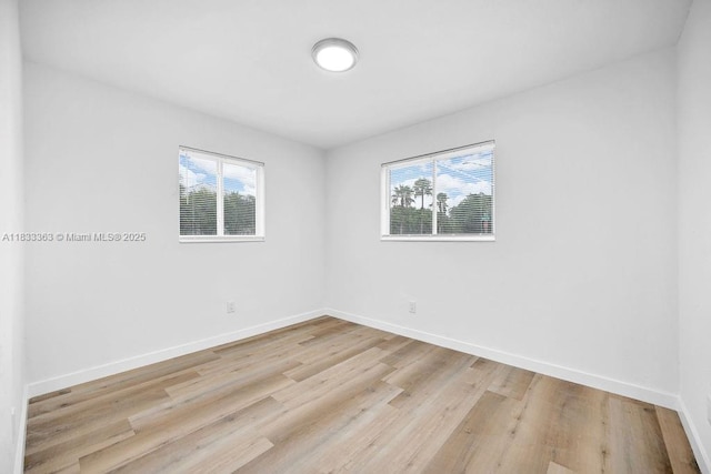 5201 Wiley St, Hollywood, FL 33021 - empty room featuring plenty of natural light and light wood-style floors