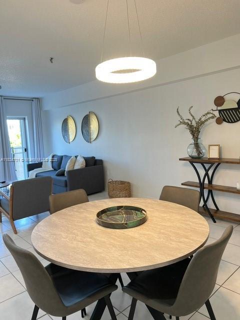 250 181st Dr Unit 212, Sunny Isles Beach, FL 33160 - dining area featuring light tile patterned floors