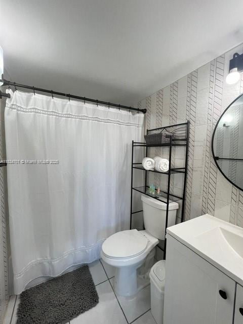 250 181st Dr Unit 212, Sunny Isles Beach, FL 33160 - full bath featuring vanity, tile patterned floors, and curtained shower