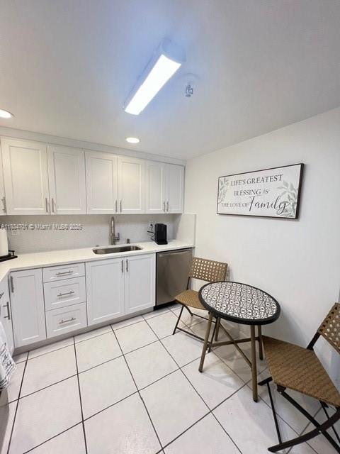 250 181st Dr Unit 212, Sunny Isles Beach, FL 33160 - kitchen with dishwasher, light countertops, white cabinetry, light tile patterned floors, and recessed lighting