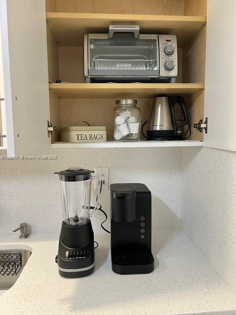 250 181st Dr Unit 212, Sunny Isles Beach, FL 33160 - kitchen view of open shelves and a sink