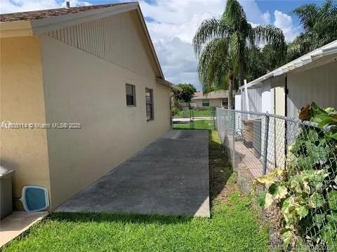 12600 SW 10th Ct, Davie, FL 33325 - view of side of property featuring stucco siding