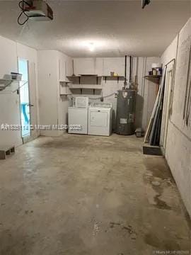 12600 SW 10th Ct, Davie, FL 33325 - garage with water heater, washing machine and clothes dryer, and a garage door opener