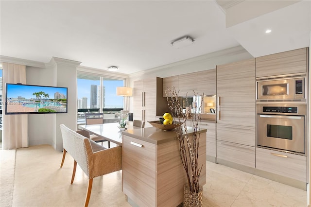 3530 Mystic Pointe Dr Unit 1714, Aventura, FL 33180 - kitchen featuring stainless steel appliances, modern cabinets, ornamental molding, a kitchen island, and a wall of windows