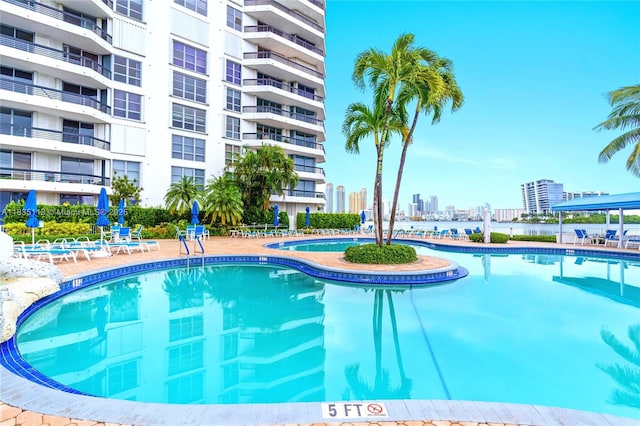 3530 Mystic Pointe Dr Unit 1714, Aventura, FL 33180 - community pool featuring a city view and a patio